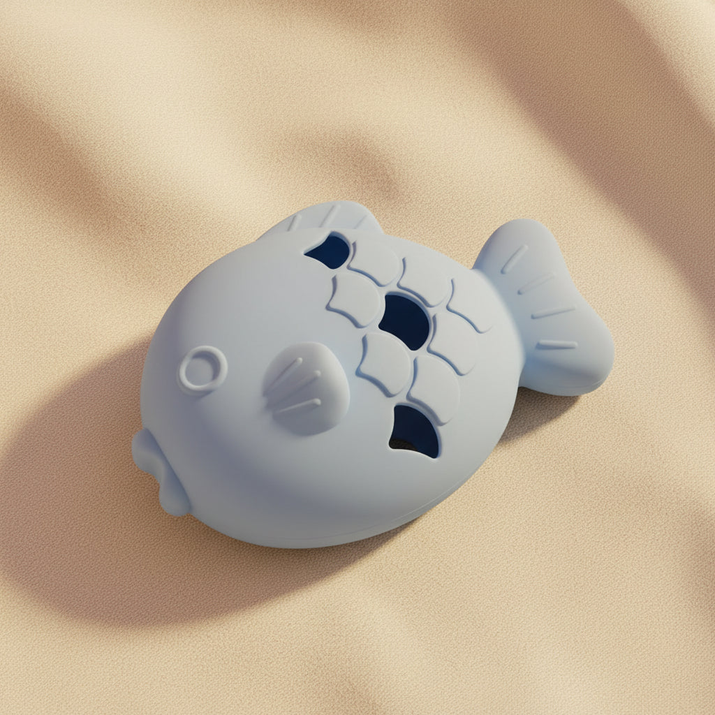 Blue fish-shaped silicone treat dispenser shown from the side